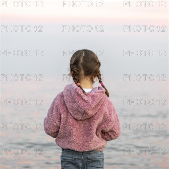 Back view girl seaside