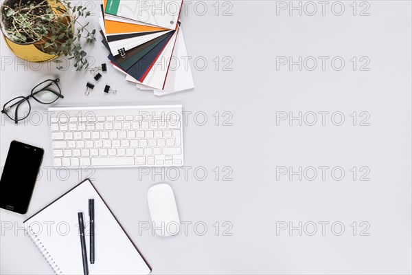 Keyboard mobile mouse stationery white background