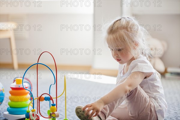 Girl with developing toys