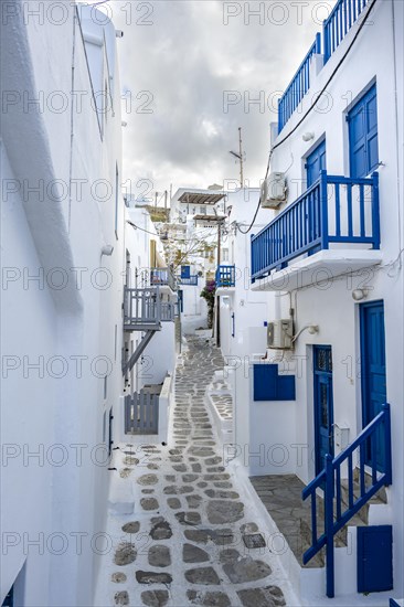 Cycladic white houses with blue shutters and doors