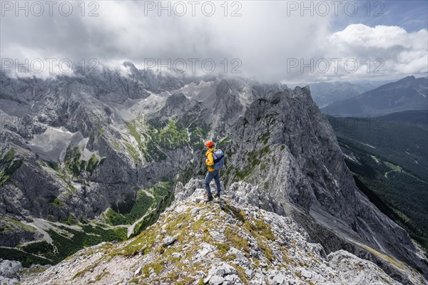 Mountaineer at the summit of the Waxenstein