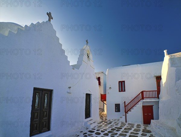 Famous tourist landmark of Greece. Entrance to Greek Orthodox Church of Panagia Paraportiani in Chora