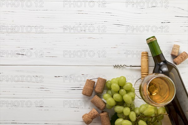 Top view bottle wine with glass bunch grapes