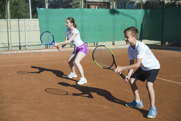 Woman kid playing tennis