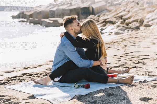 Amorous gentle couple embracing beach