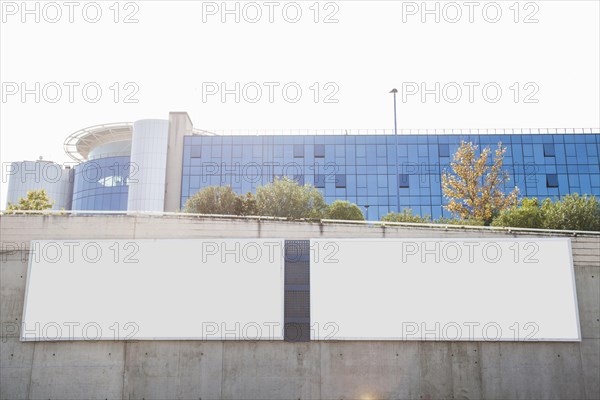 White blank billboards concrete wall front corporate building
