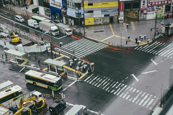 Busy crosswalk city with traffic