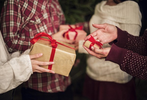 Hands people exchanging presents christmas