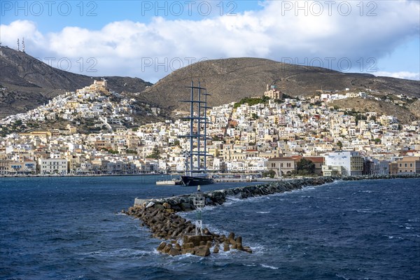 View of the town of Ermoupoli with harbour and large sailing ship