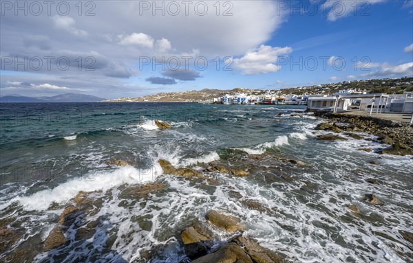 Waves breaking between the rocks on the beach