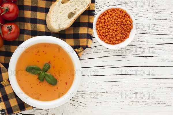 Flat lay pumpkin bisque bread lentil bowl with copy space