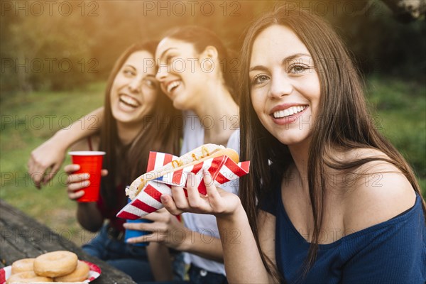 Girl with friends resting park