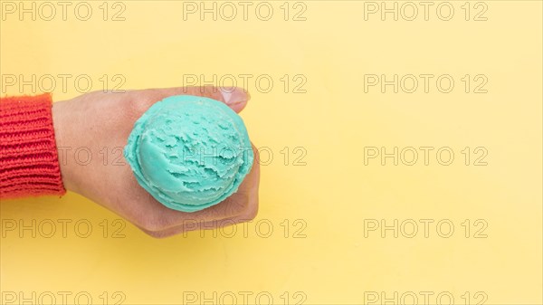 Crop hand holding ice cream