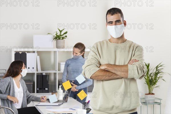 Medium shot man working with mask