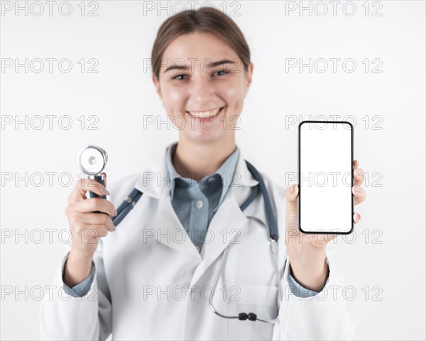 Portrait doctor holding mobile phone