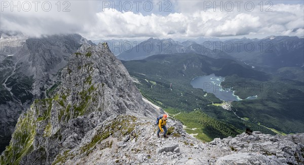 Mountaineer at the summit of the Waxenstein