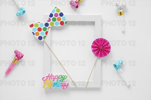 Empty frame with colorful birthday items
