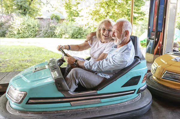 Happy man woman driving car