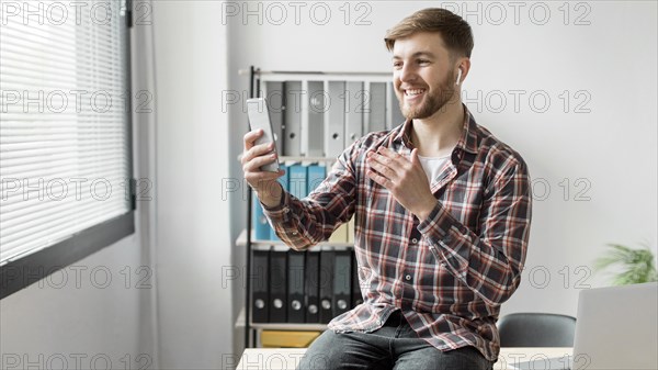 Man using mobile video call