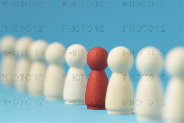 Focused red pawn surrounded by white ones