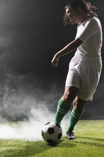 Young woman sportswear playing soccer