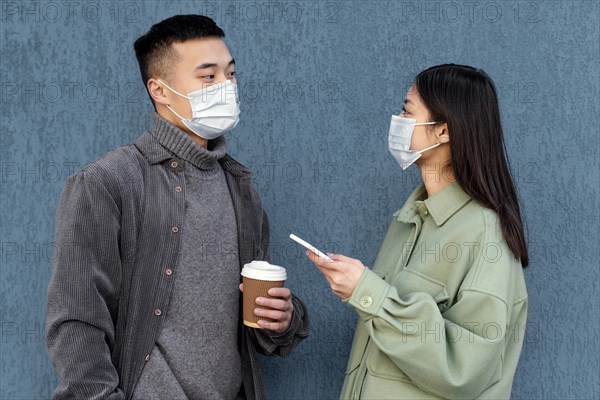 Young japanese couple wearing mask