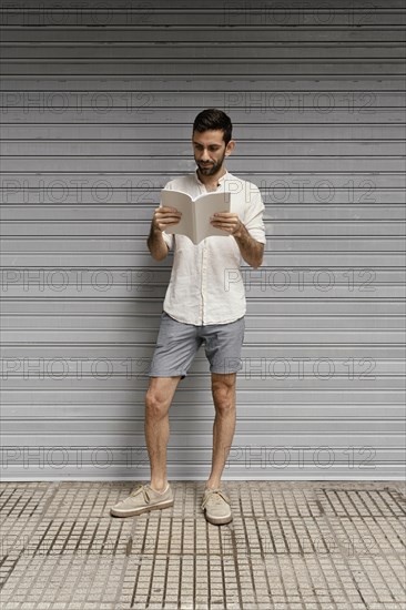 Man reading interesting book