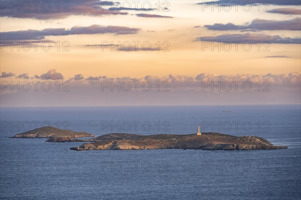 View of the sea and Didimi Island with lighthouse at sunset