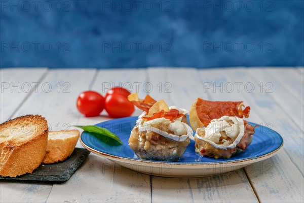 Mushrooms stuffed with goat cheese and iberian cured ham typical spanish tapa