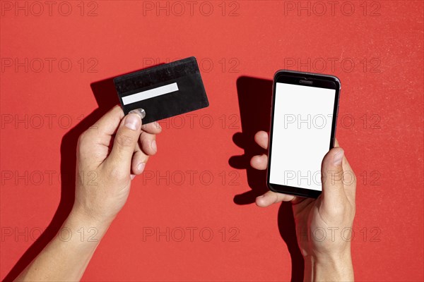 Hands holding credit card phone mock up