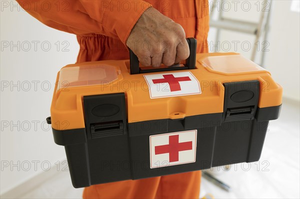 Portrait man with safety protection equipment first aid kit