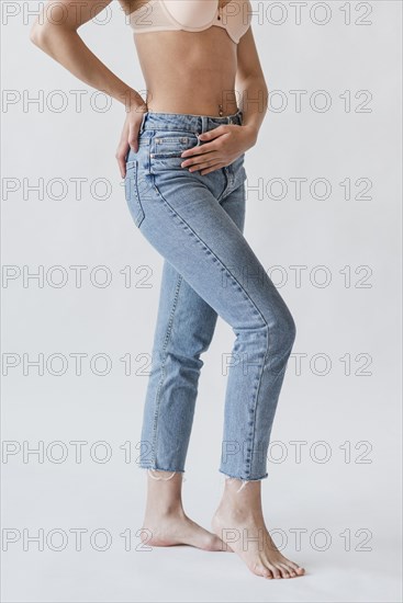 Crop female legs denim