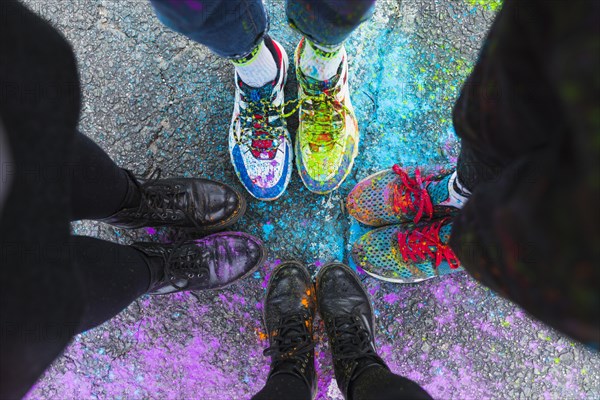 Feet people standing road colorful paint