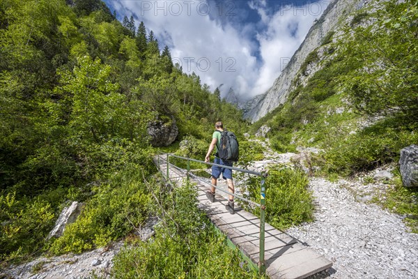 Mountaineer on bridge over the Hammersbach