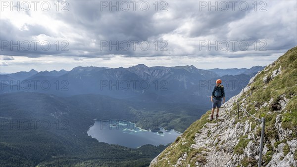 Climbers on a steel-rope-secured path