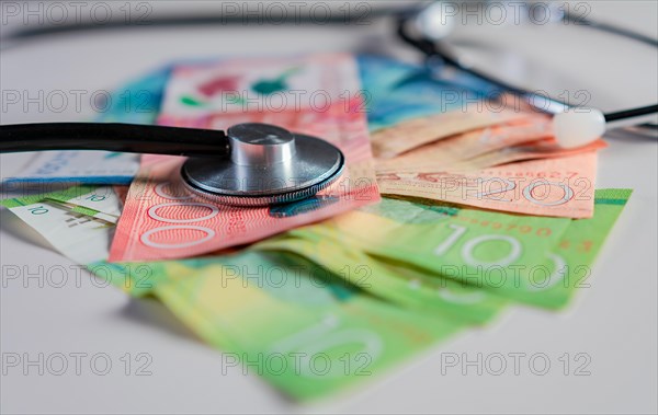 Stethoscope on Nicaraguan banknotes on white background. Stethoscope on Nicaraguan banknote isolated. Nicaraguan healthcare cost concept
