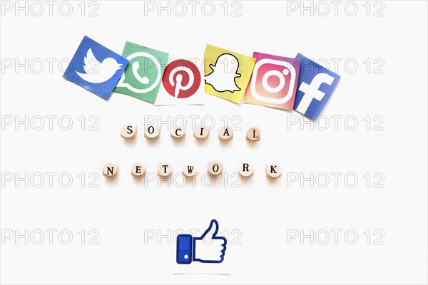 Elevated view various mobile application icons social network word thumbs up sign