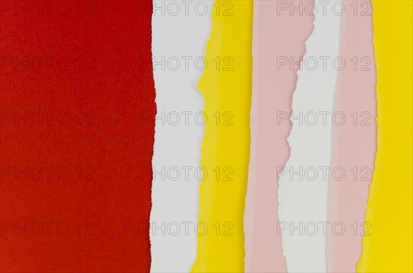 Red yellow vertical torn papers