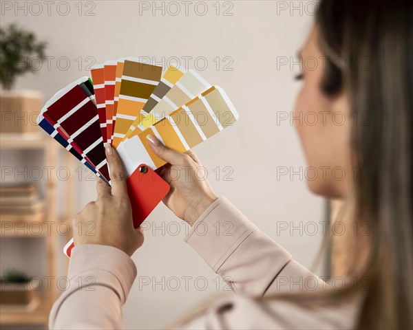 Close up woman holding colour palette