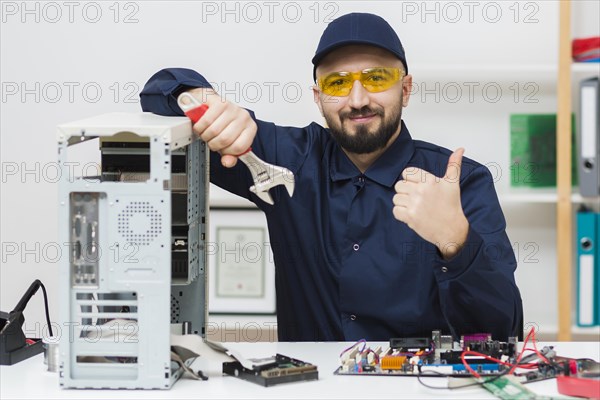 Front view man troubleshooting computer