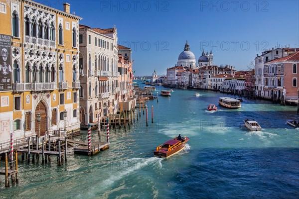 Boat traffic on the Grand Canal with the church of Santa Maria della Salute