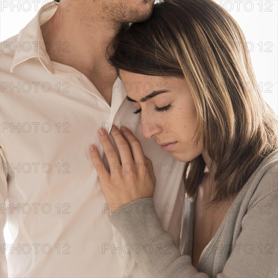 Close up man holding upset woman