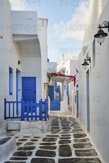 Charming traditional narrow streets and beautiful alleyways of Greek island towns. Whitewashed houses