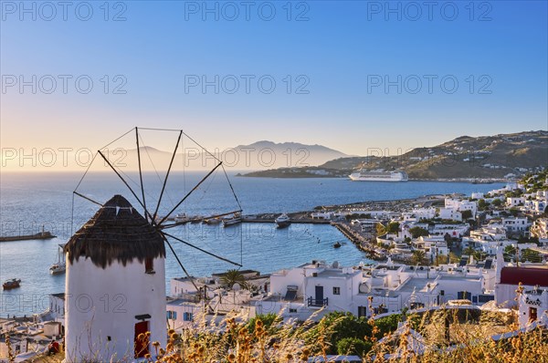 Beautiful view famous Greek white windmill overlooking Chora