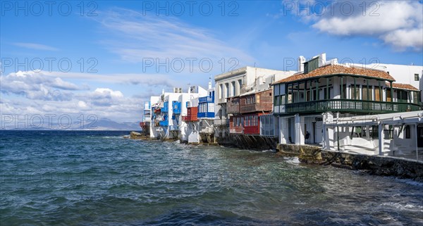 White Cycladic houses on the shore