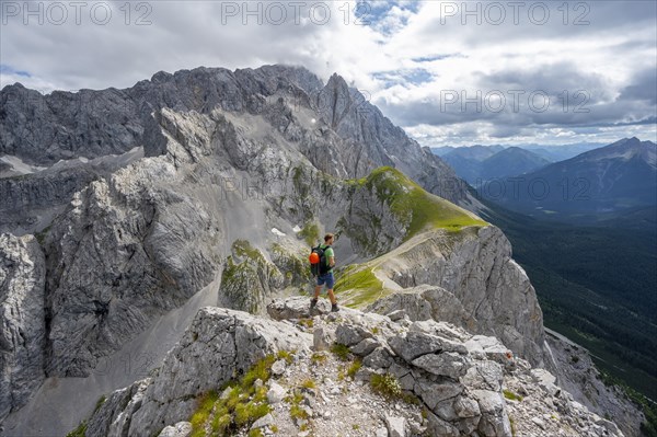 Mountaineer at the summit of the Suedliche Riffelspitze