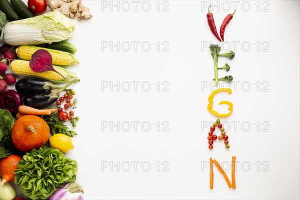 Flat lay vegan lettering made out vegetables