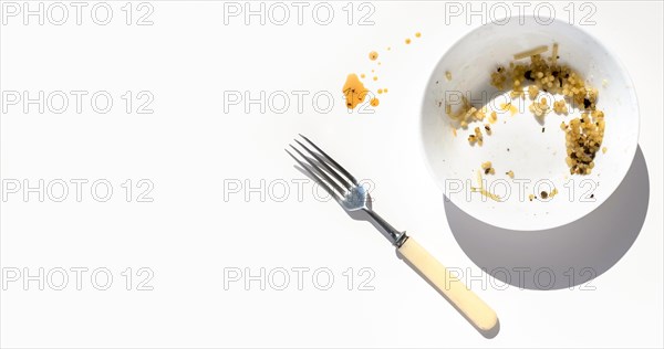 Top view dirty plate with food leftovers