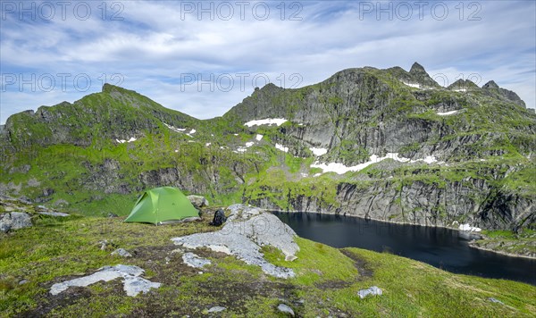 Green tent in the mountains