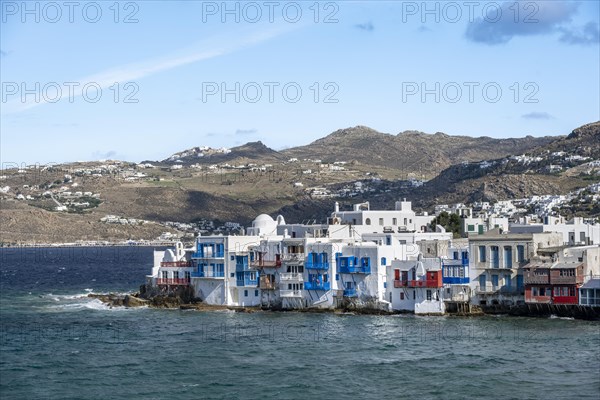 White Cycladic houses on the shore